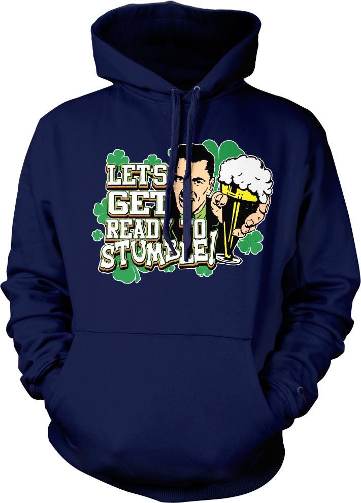 A navy blue hoodie with a graphic design featuring a man holding a beer and the text "Let's get ready to stumble" along with shamrocks.