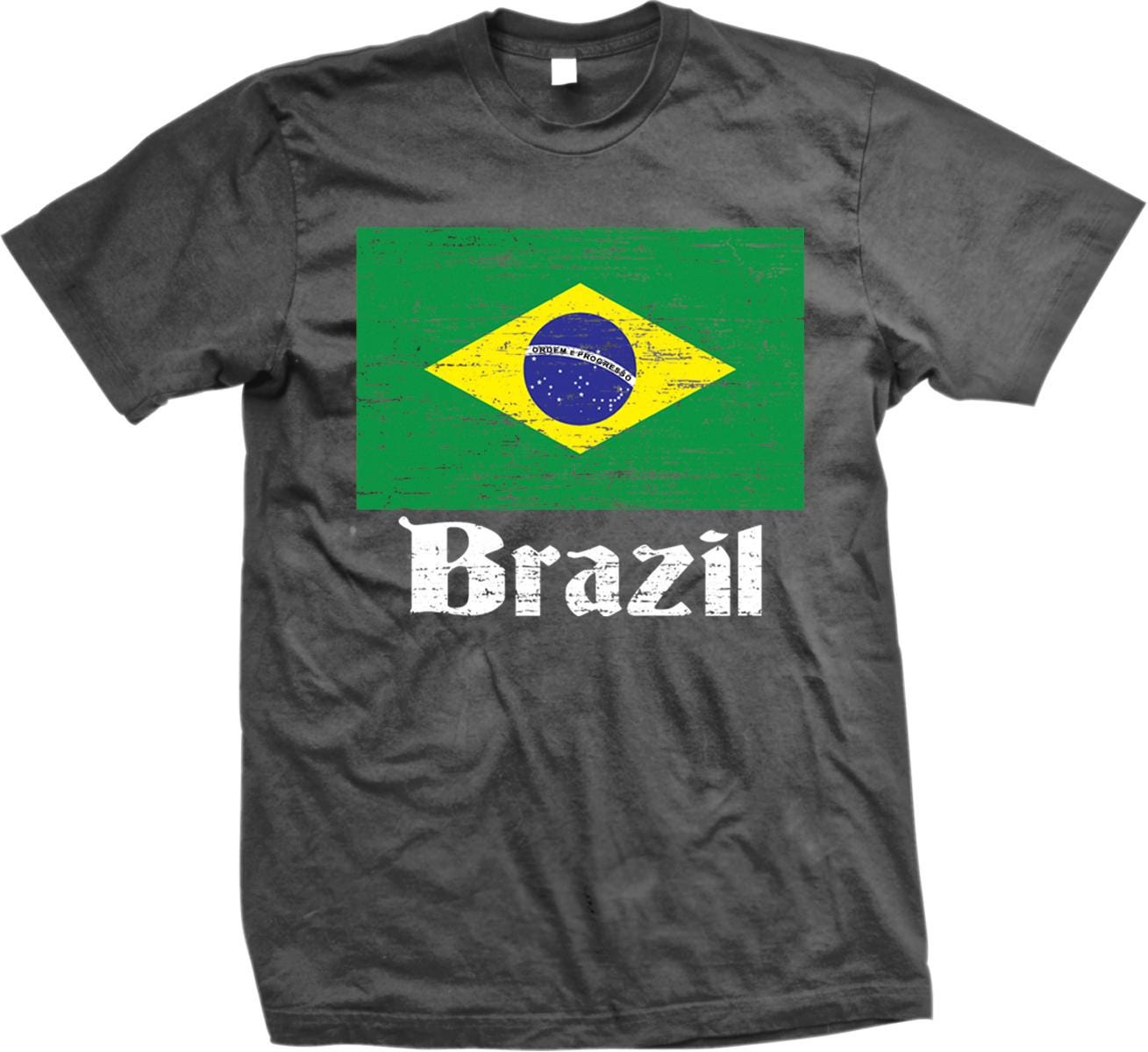 A black t-shirt with a graphic design of the Brazilian flag and the word "Brazil" printed on it.