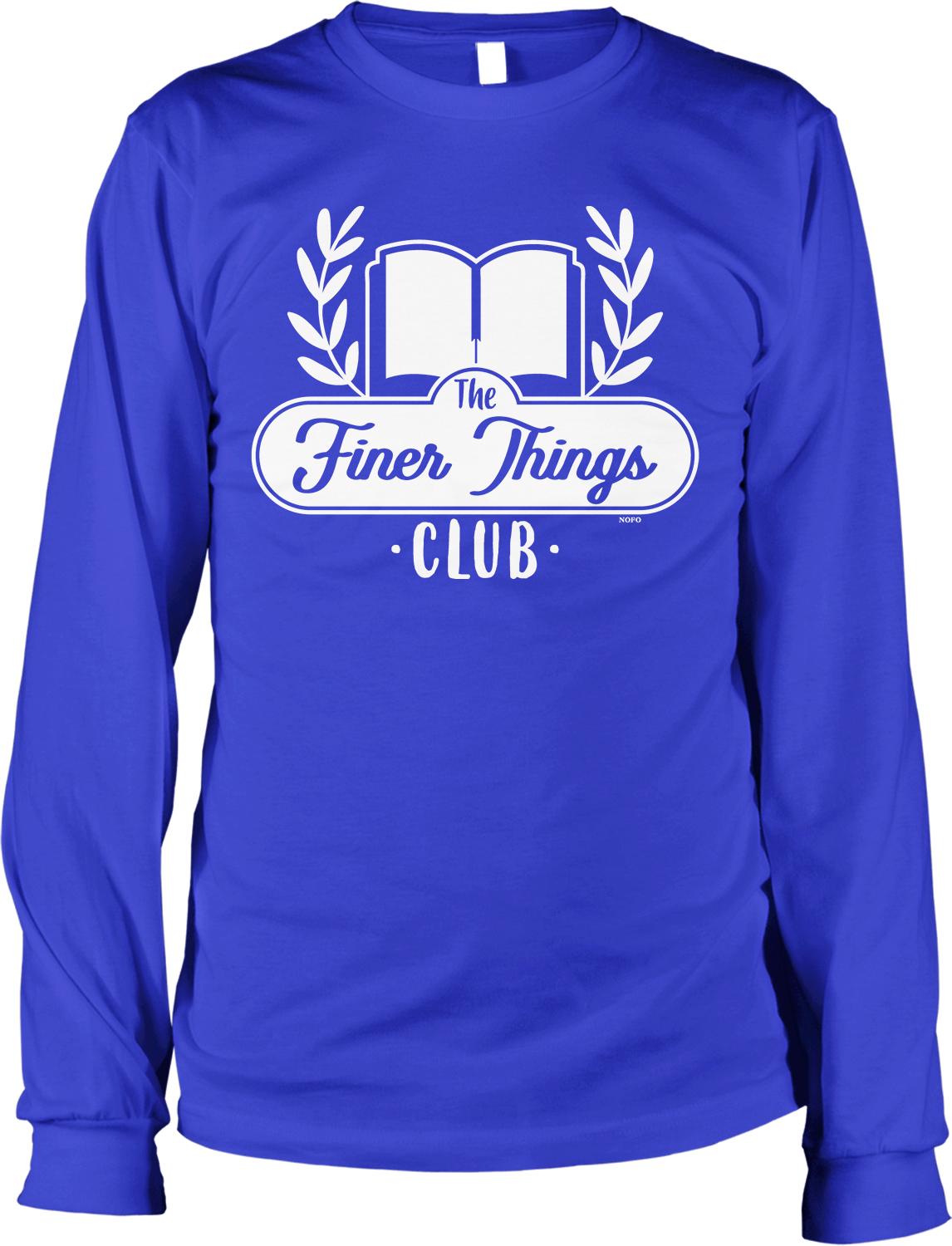 A long-sleeved blue t-shirt with a white logo that says "The Finer Things Club" printed on it.