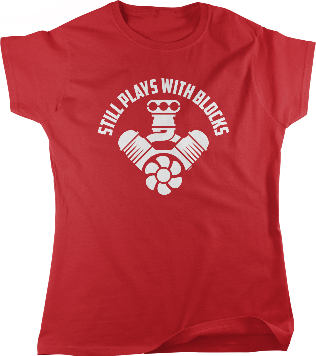 A red t-shirt with a white graphic design that says "STILL PLAYS WITH BLOCKS" around a stylized engine or car.