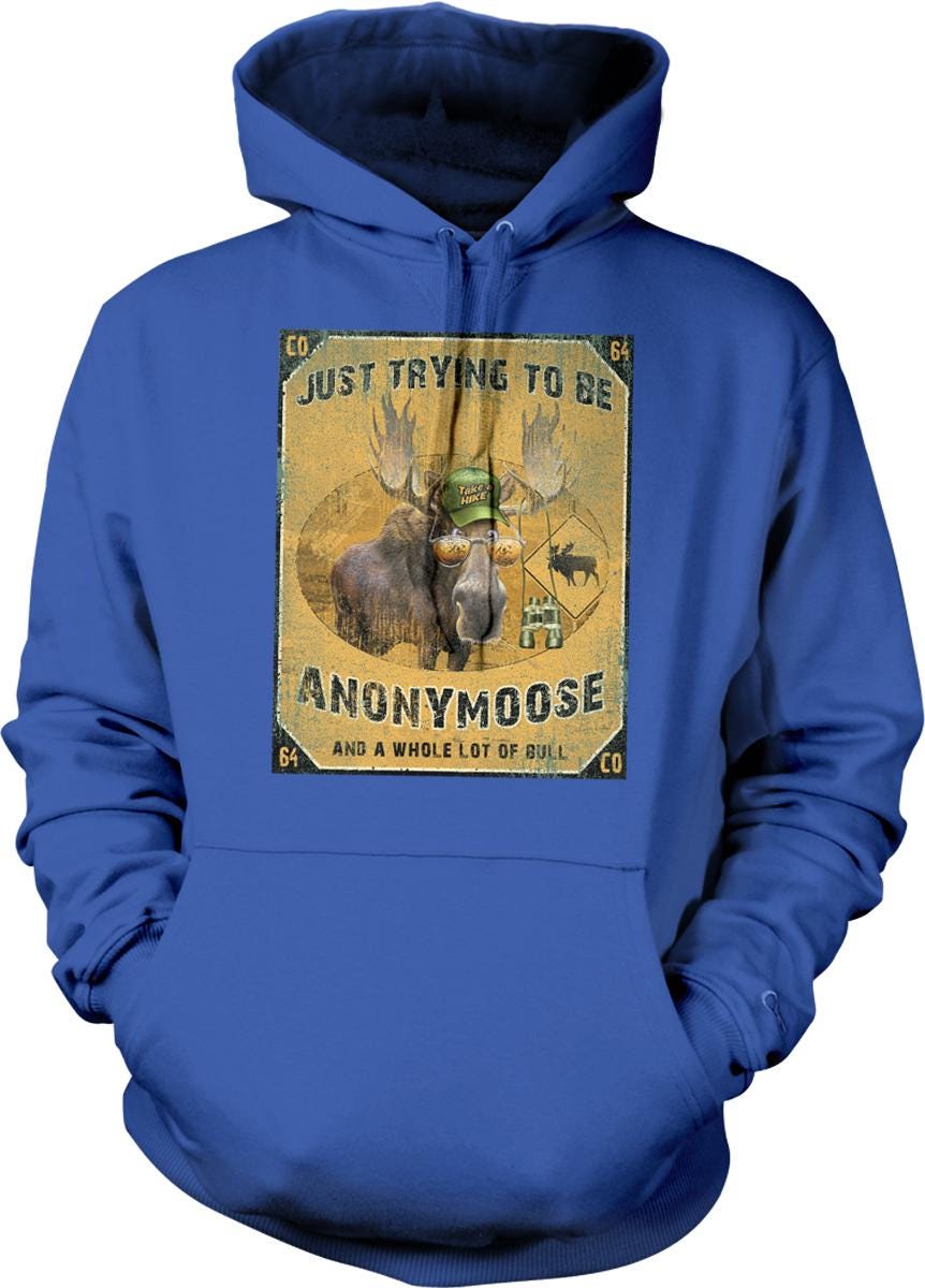 A blue hoodie with a graphic design featuring a moose wearing a hat and the text "Just trying to be ANONYMOOSE and a whole lot of bull".