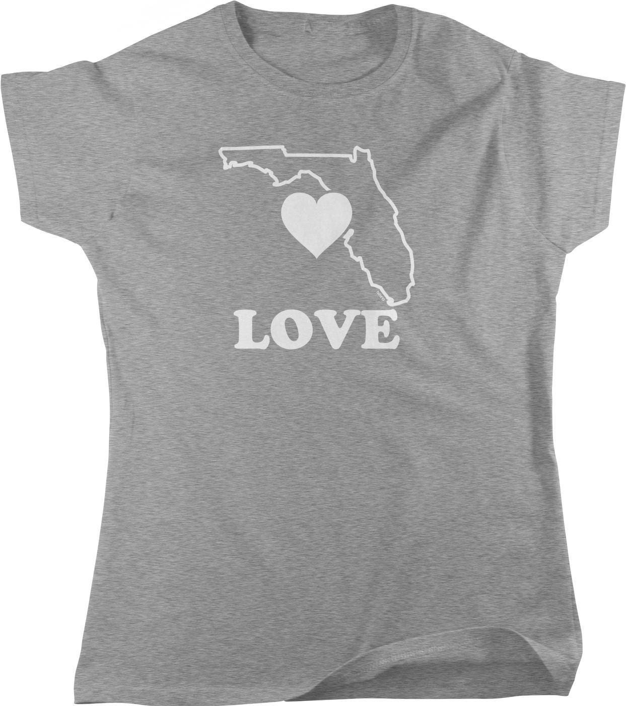 A gray t-shirt with a graphic design featuring a heart symbol inside a map of Florida and the word "LOVE" written below it.