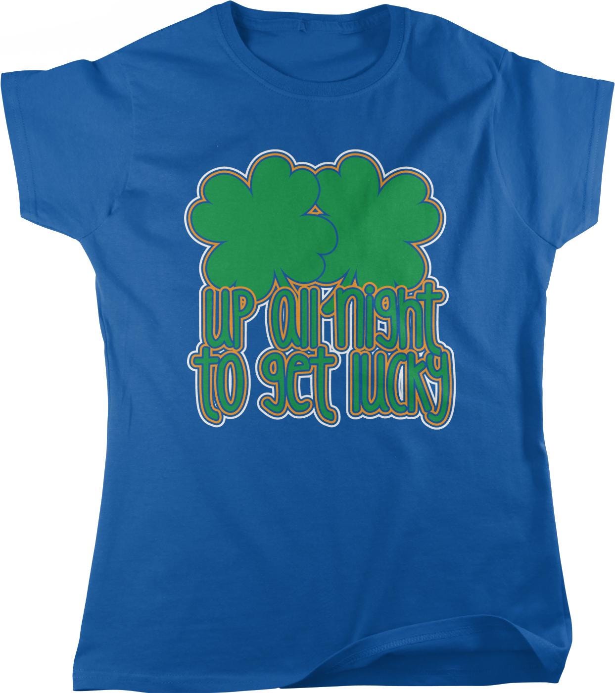 A blue t-shirt with a graphic design featuring a pair of green shamrocks and the text "UP at night to get lucky".