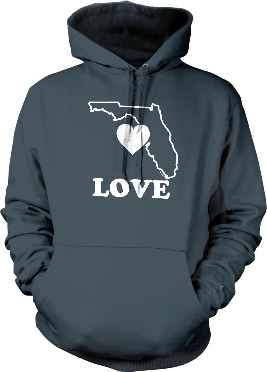 A gray hoodie with a graphic design featuring a heart shape and the word "LOVE" printed on it.