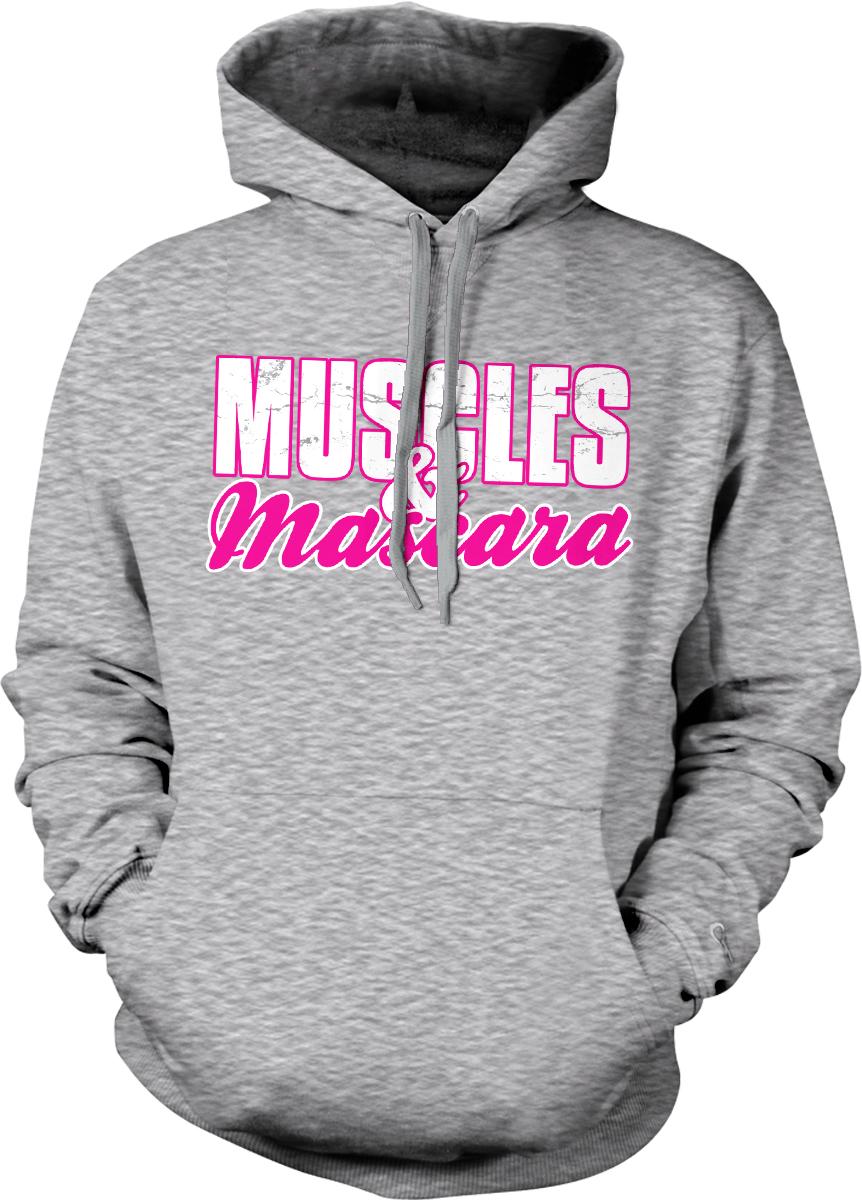 A gray hoodie with the text "MUSCLES & MASCARA" printed on it in pink and white.