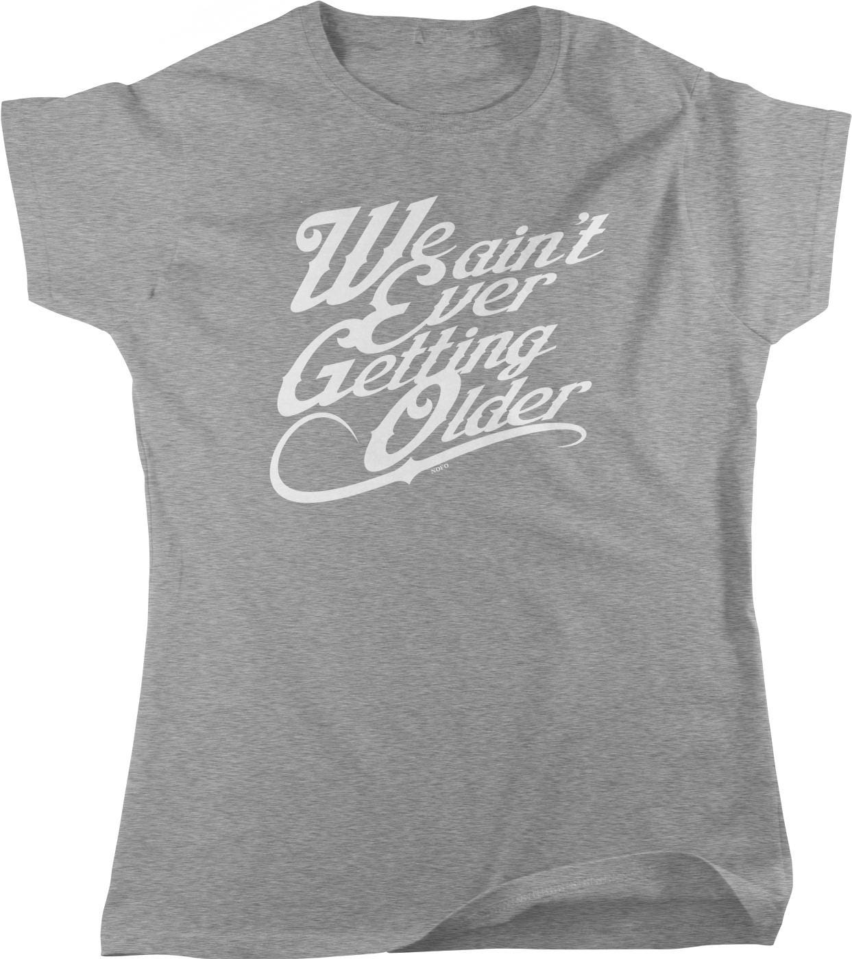 A gray t-shirt with the text "We ain't ever getting older" printed on it in a cursive font.
