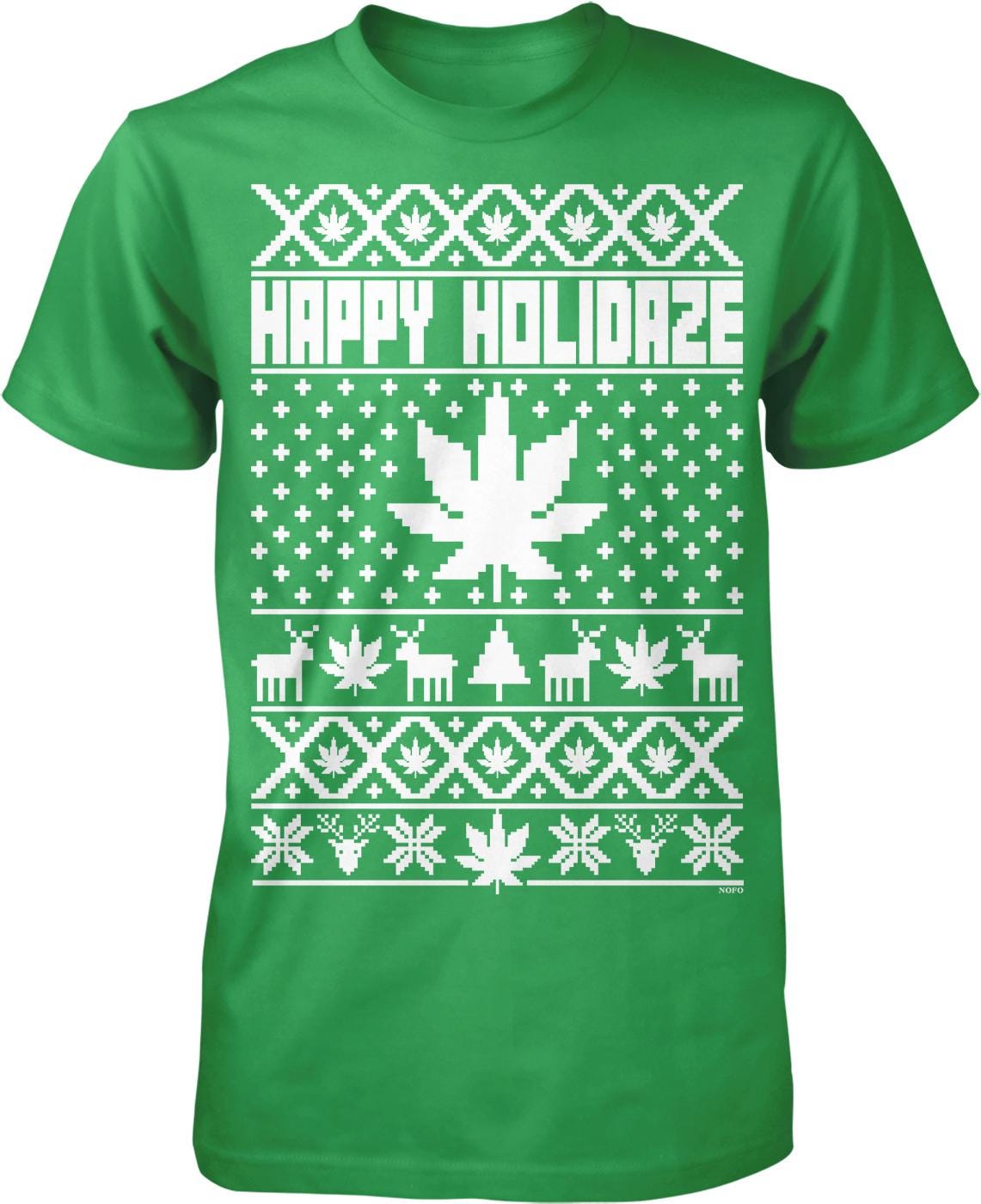 A green t-shirt with a white Christmas-themed design. The design includes a Christmas tree, snowflakes, reindeer, and a marijuana leaf. The text "HAPPY HOLIDAZE" is displayed prominently across the shirt.
