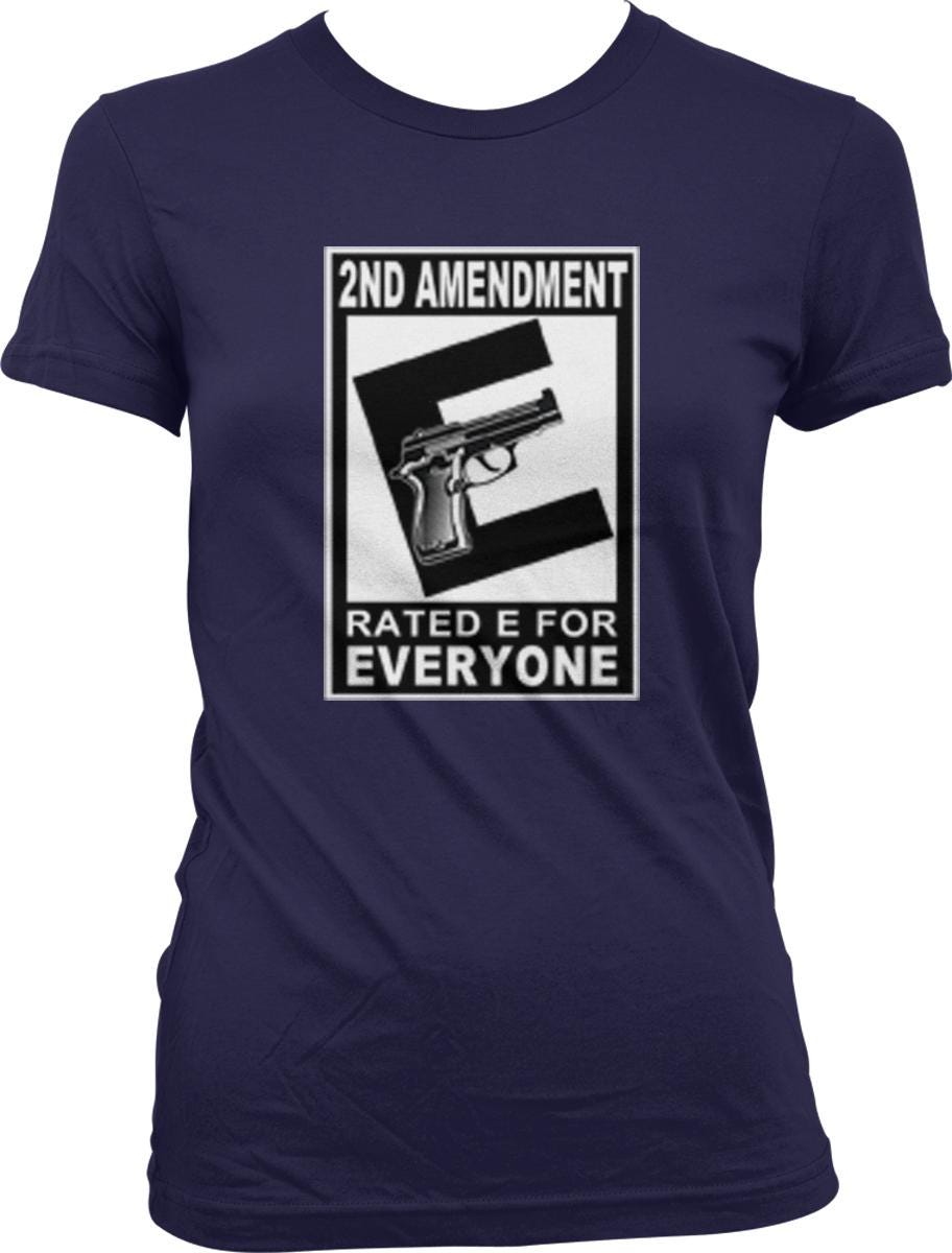 A navy blue t-shirt with a graphic design that says "2ND AMENDMENT RATED E FOR EVERYONE" and features a graphic of a gun.