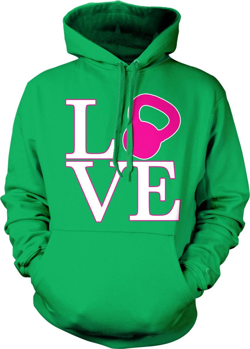 A green hoodie with a pink kettlebell graphic and the word "LOVE" printed on it.