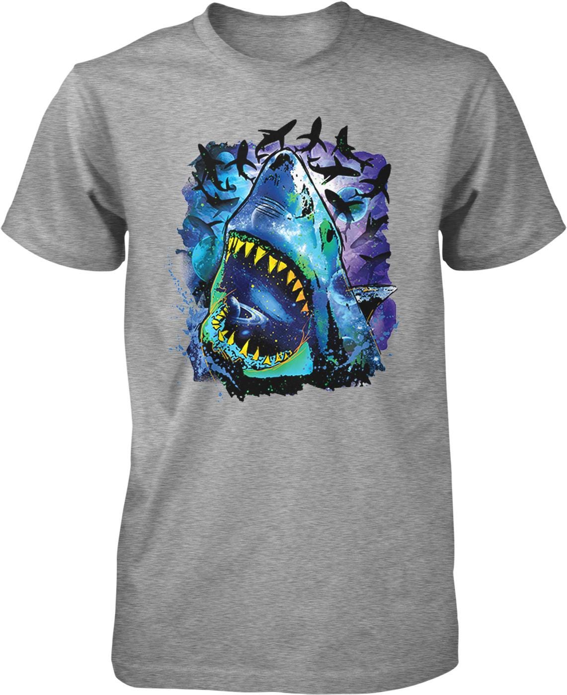 A gray t-shirt with a graphic design depicting a large, open-mouthed shark surrounded by colorful, abstract elements.
