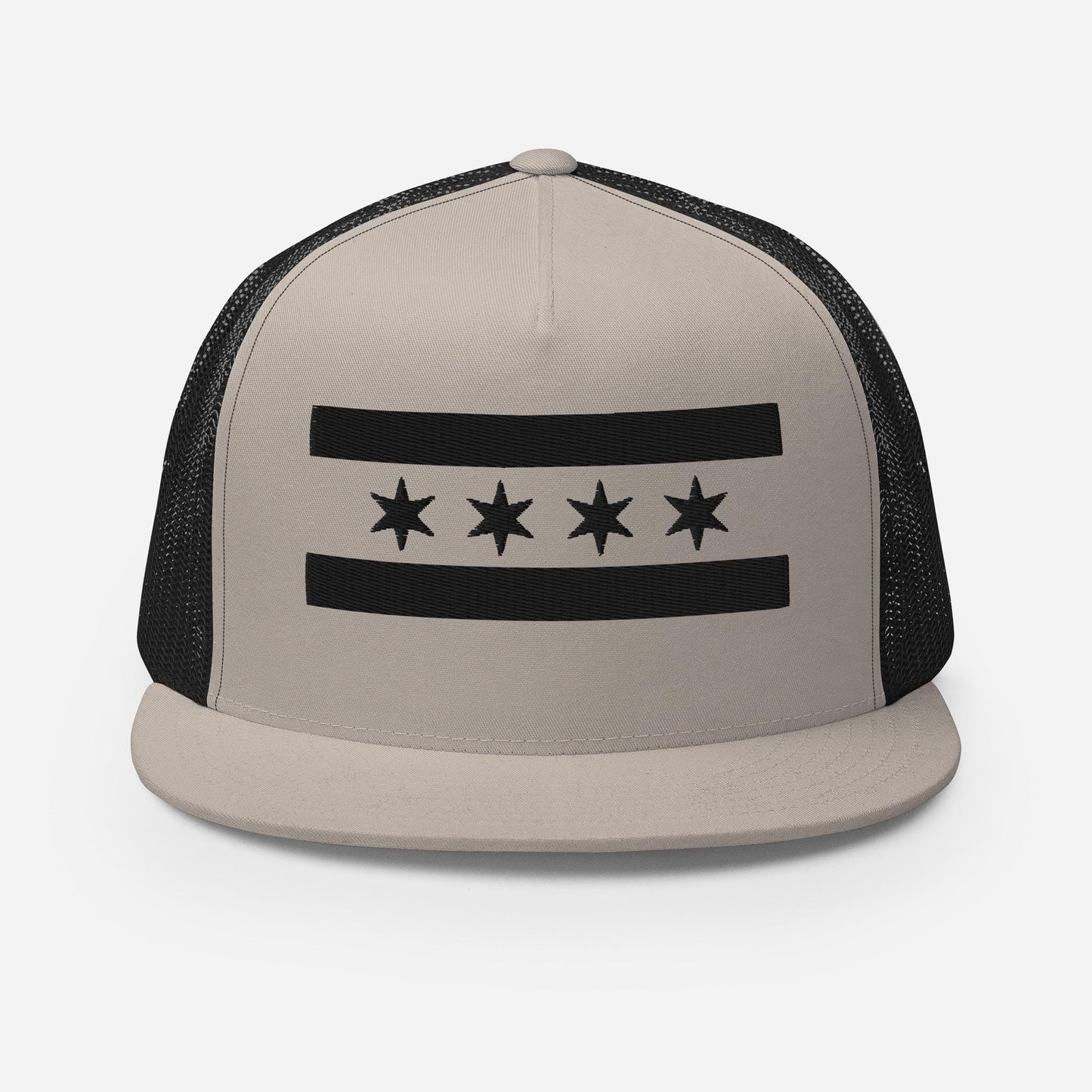 A beige baseball cap with a black and white graphic design on the front.
