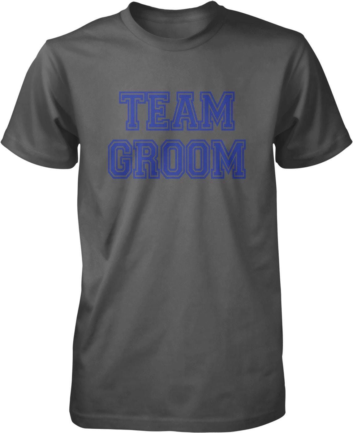 A gray t-shirt with the text "TEAM GROOM" printed in blue letters.