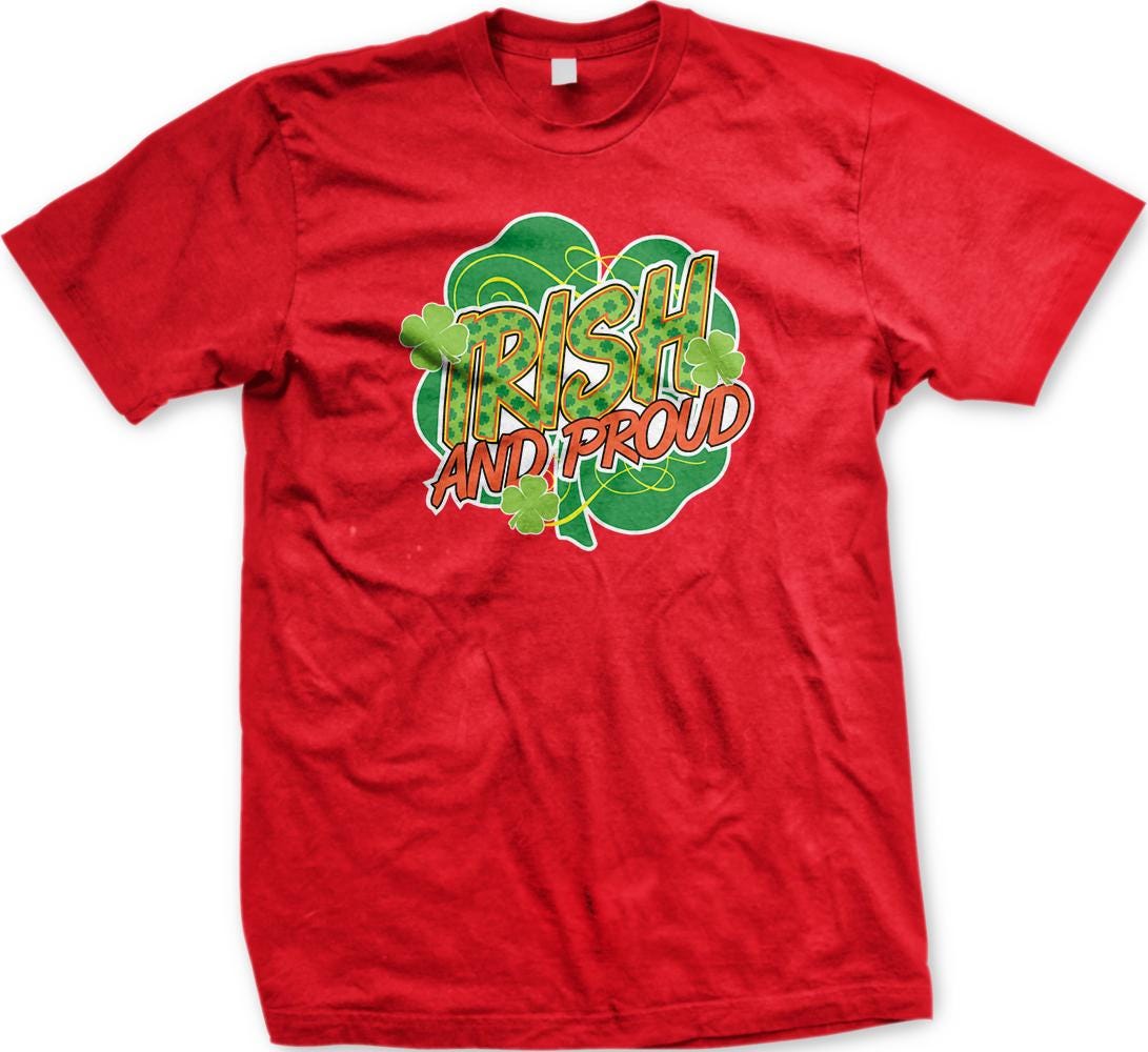 A red t-shirt with a graphic design featuring the text "Irish and proud" surrounded by a shamrock and other shamrocks.