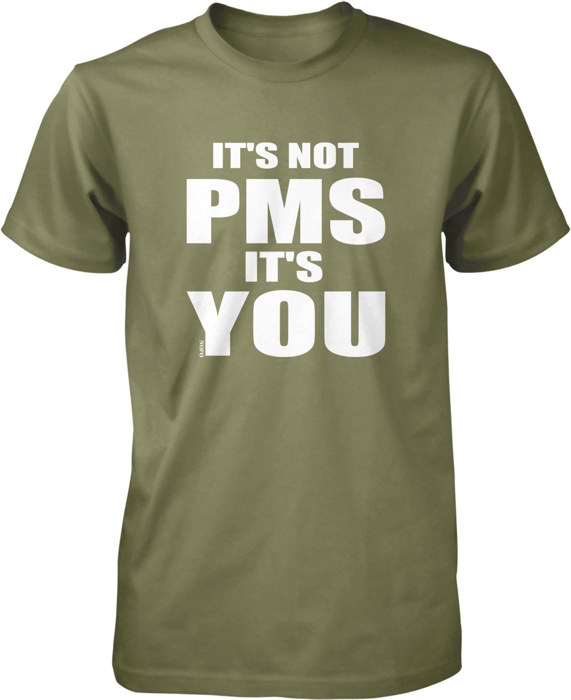 A green t-shirt with white text that reads "IT'S NOT PMS IT'S YOU".