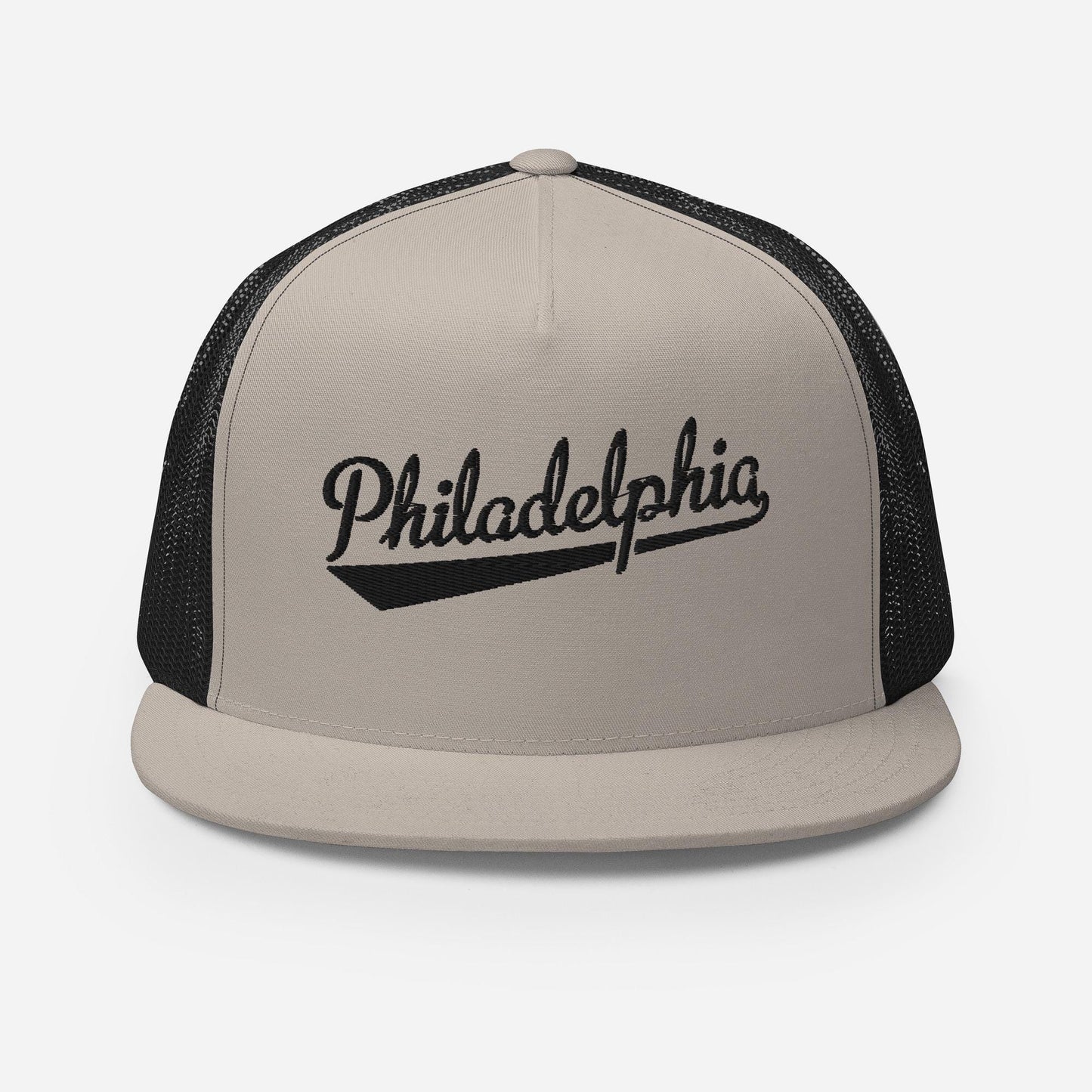 A beige baseball cap with the word "PhiladELPHIA" printed on it in black text.