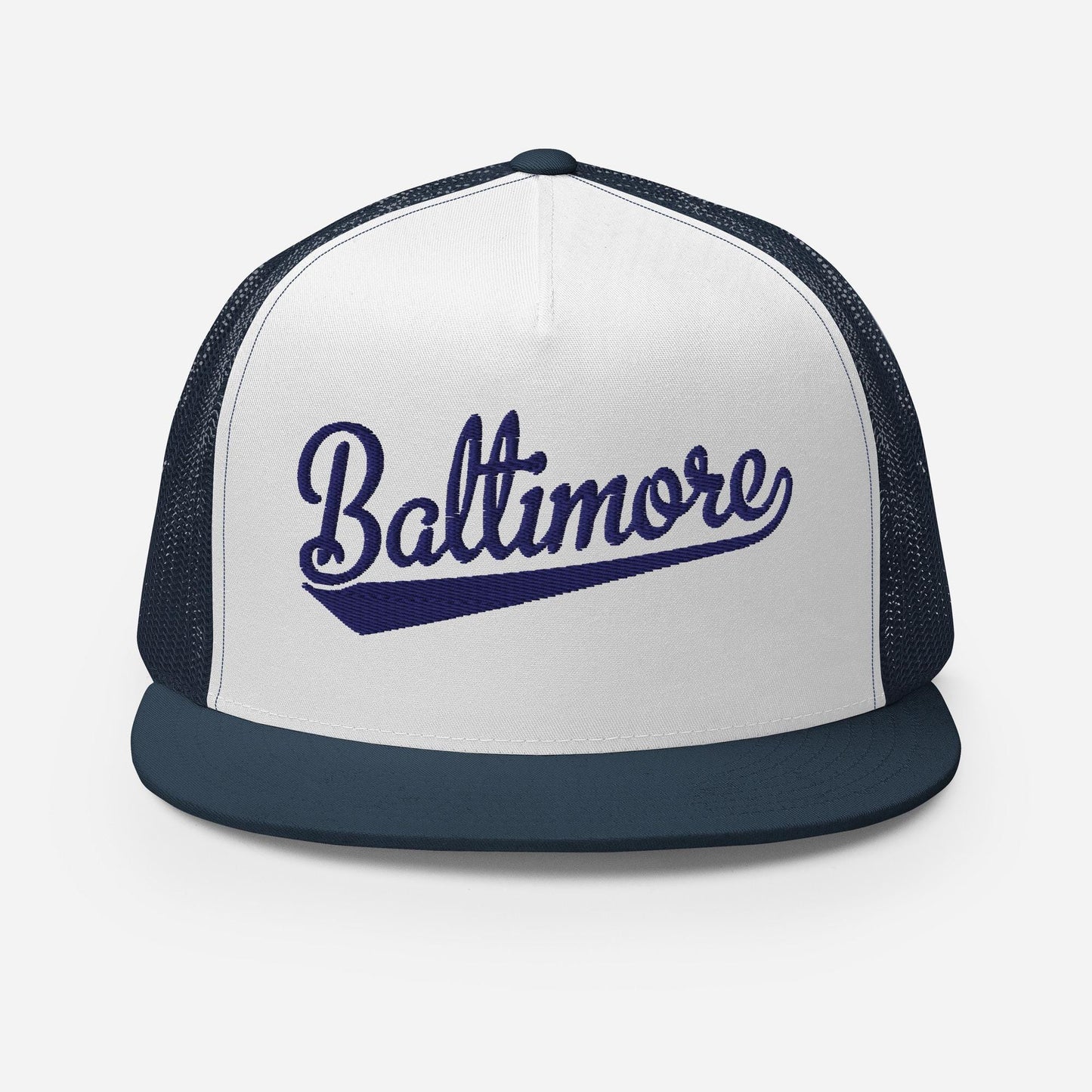 A white and navy blue baseball cap with the word "Baltimore" printed on it in a cursive font.