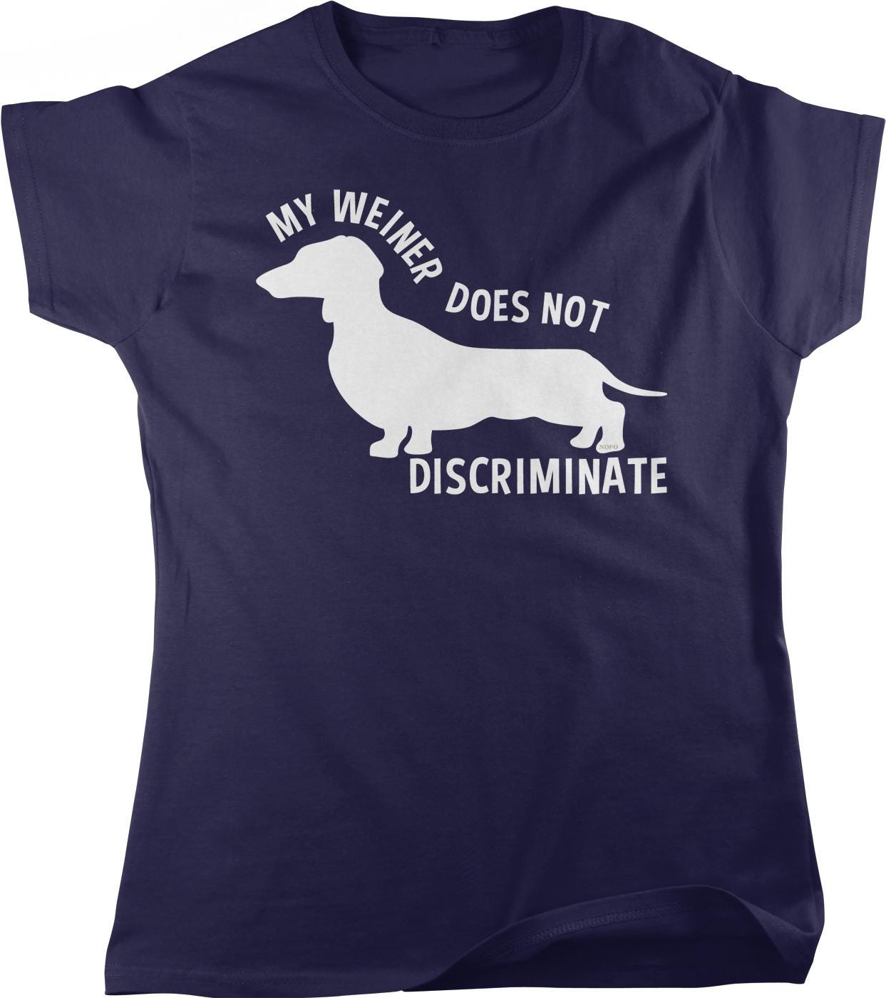 The image is a navy blue t-shirt with a white graphic design depicting a dachshund dog and text that reads "MY WEINER DOES NOT DISCRIMINATE".