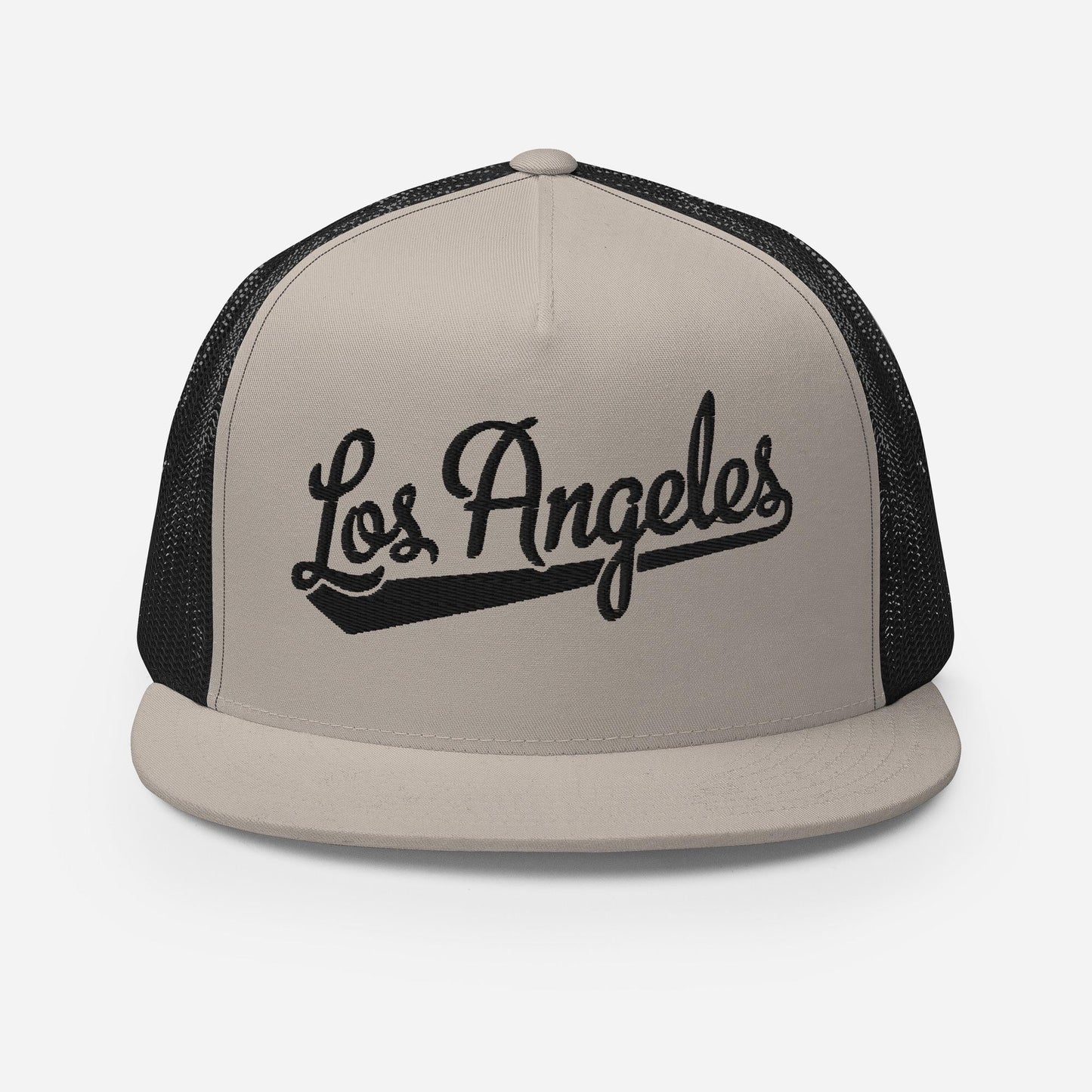 A beige baseball cap with the text "Los Angeles" printed on it in a stylized font.