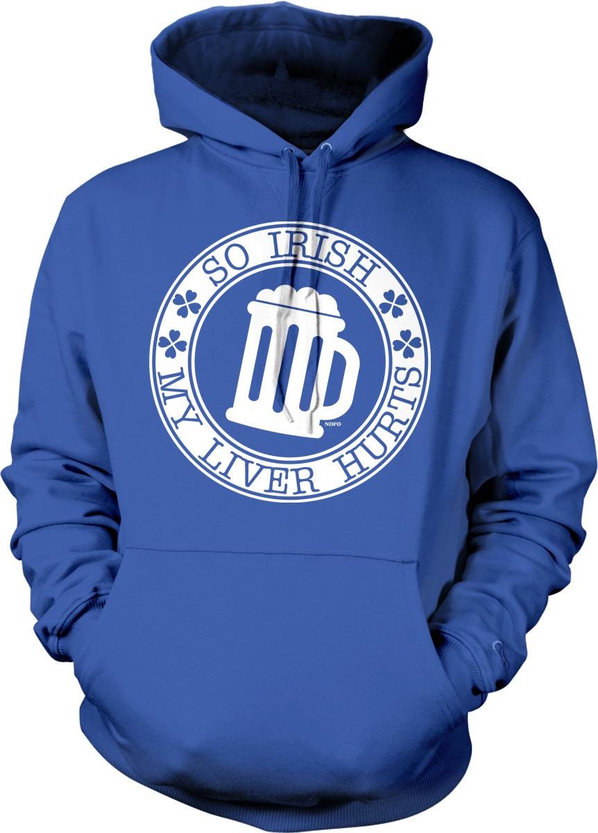 A blue hoodie with a white graphic design on it. The design features a mug with a clover symbol and the text "So Irish, my liver hurts" around the mug.