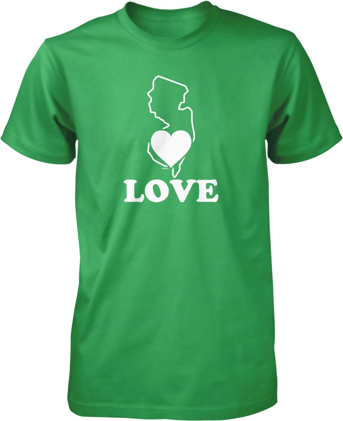 A green t-shirt with a white graphic design that includes a heart shape and the word "LOVE" written below it.