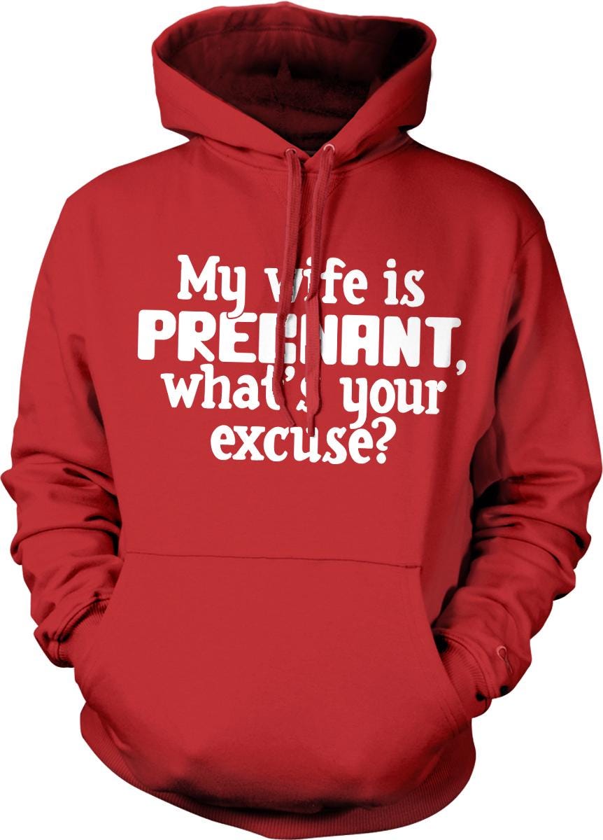 A red hoodie with white text that reads "My wife is pregnant, what's your excuse?"
