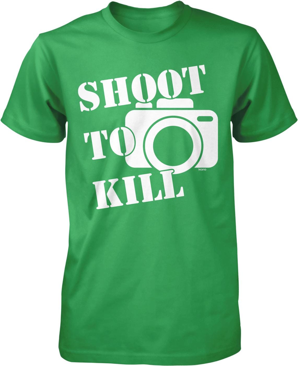 A green t-shirt with the text "SHOOT TO KILL" printed on it, along with a graphic of a camera.
