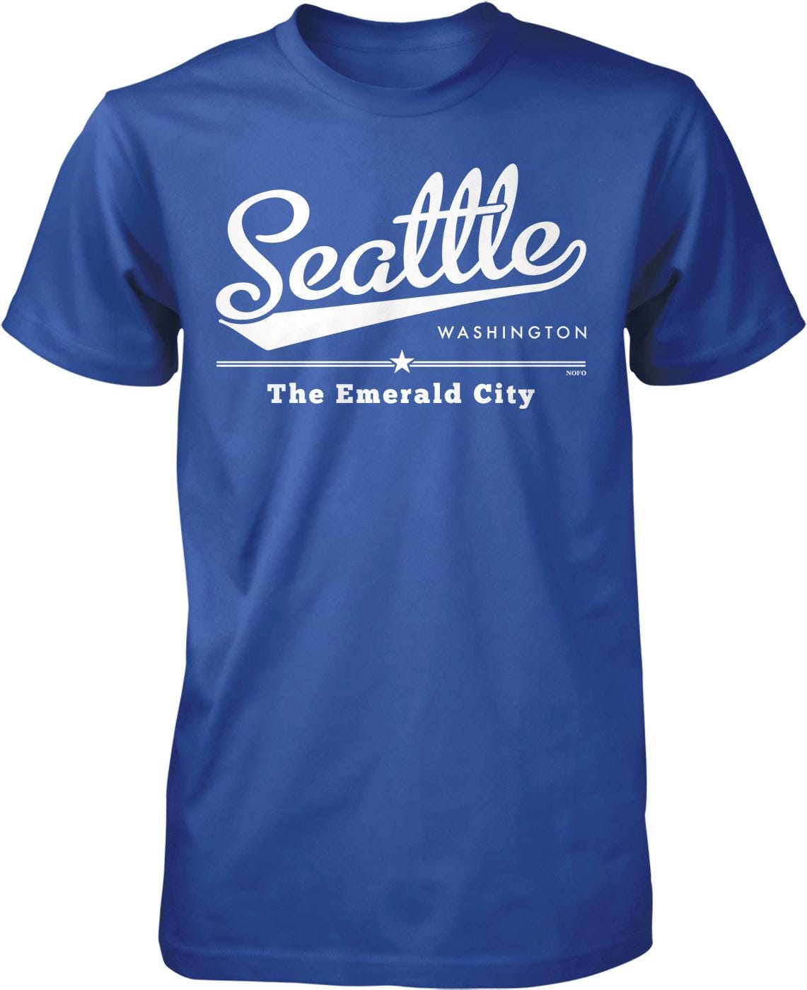 A blue t-shirt with white text and graphics that say "Seattle Washington The Emerald City".