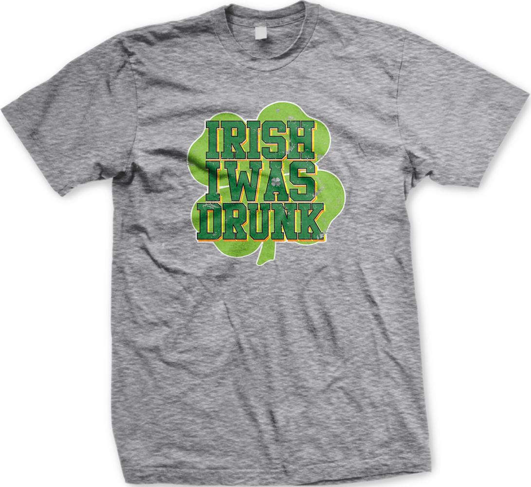 A grey t-shirt with a graphic design featuring the text "IRISH WAS DRINK" in a stylized font, surrounded by a shamrock symbol.