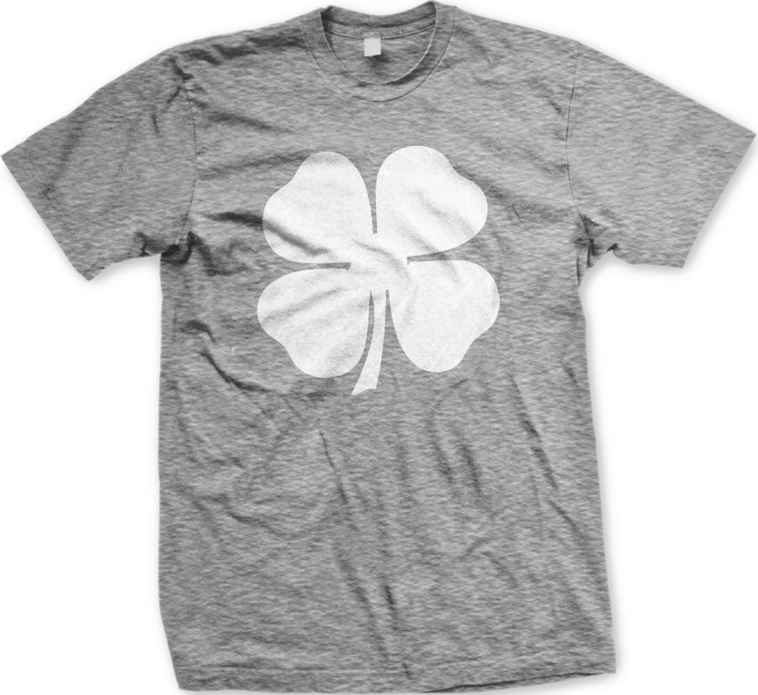 A gray t-shirt with a white four-leaf clover graphic printed on it.
