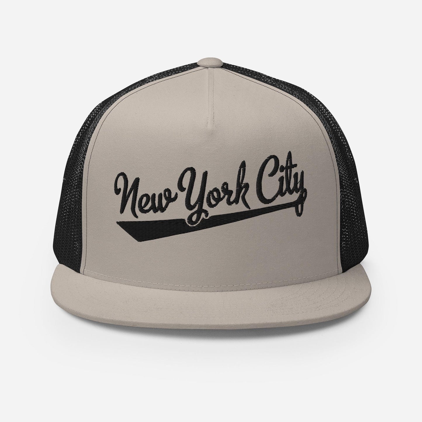 A beige baseball cap with the text "New York City" printed on it in a stylized font.