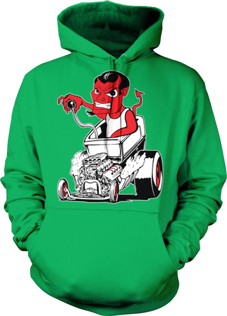 A green hoodie with a graphic design depicting a red devil-like character sitting in a car with a large engine.