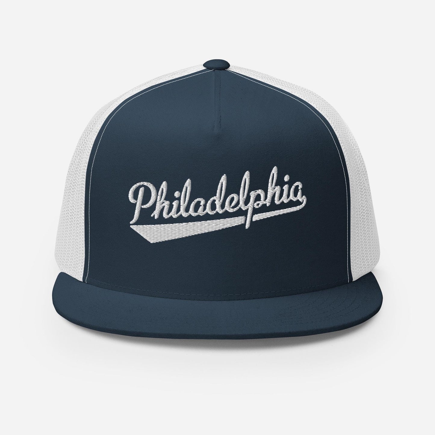 A navy blue baseball cap with white trim, featuring the word "PhiladELPHIA" embroidered on the front in a cursive script.