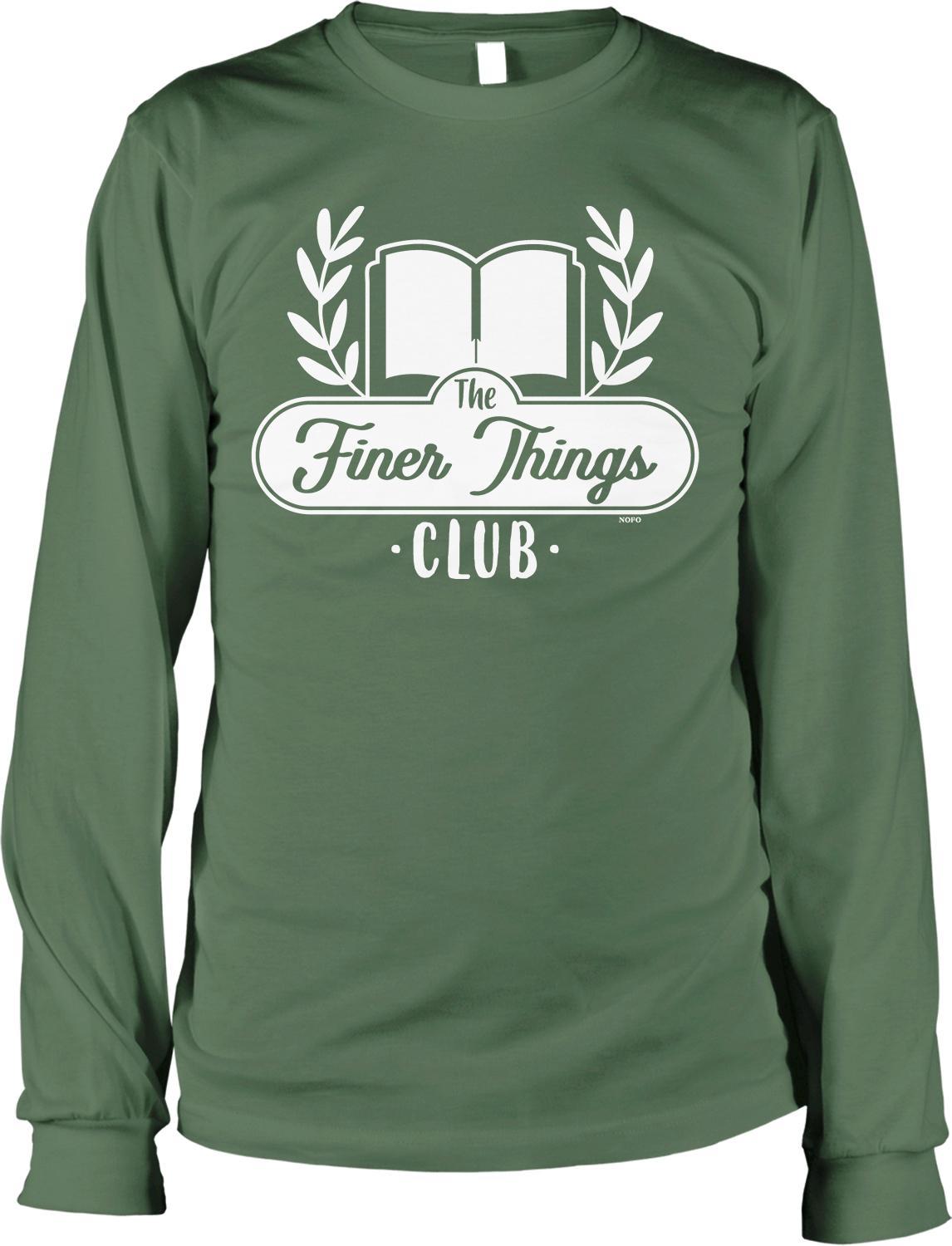 A green long-sleeved t-shirt with a white logo that says "The Finer Things Club" printed on it.