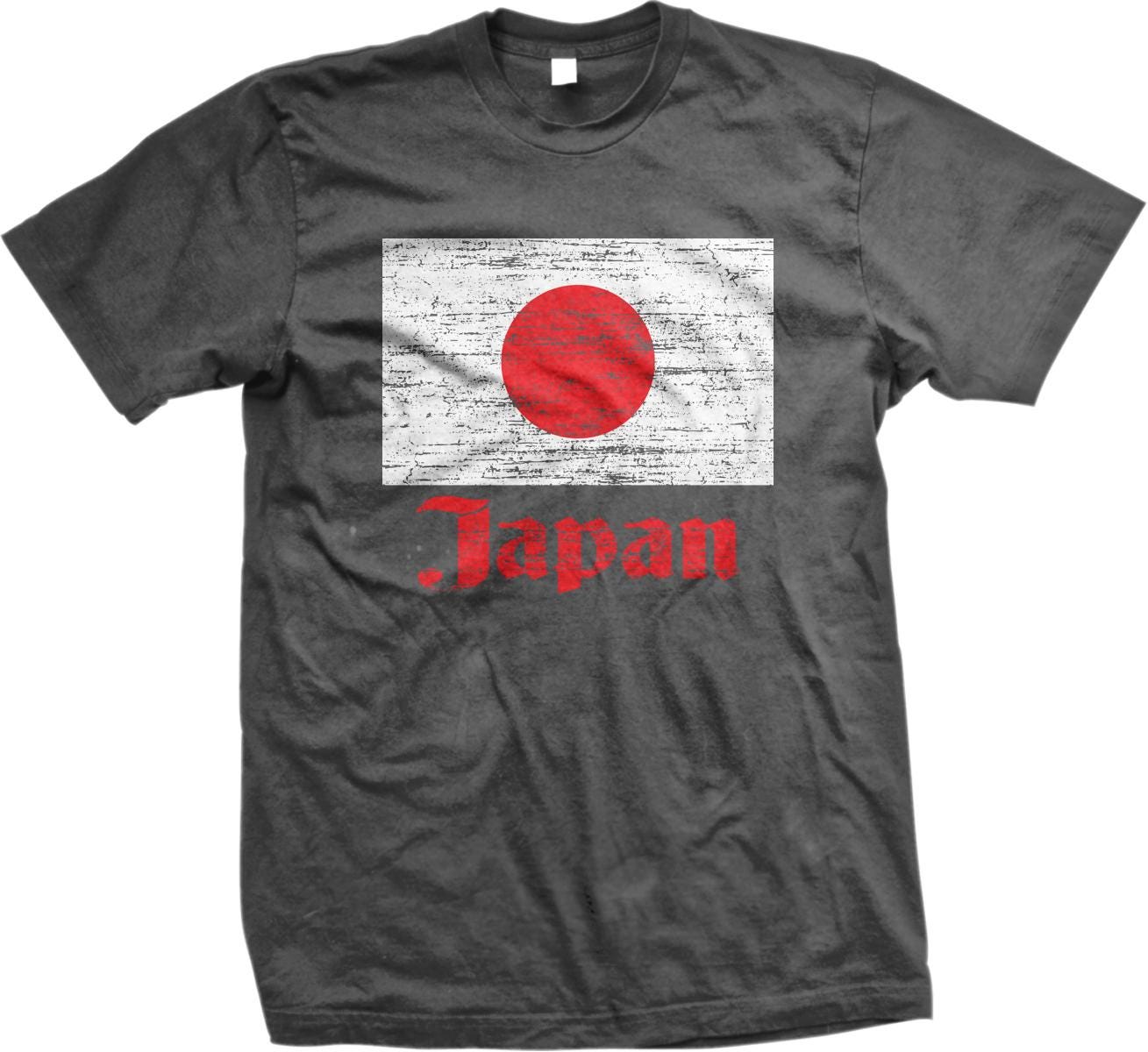 A gray t-shirt with a graphic design featuring the flag of Japan and the word "Japan" written below it.