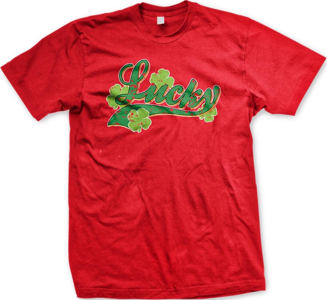 A red t-shirt with the word "Lucky" printed on it, along with green shamrocks.