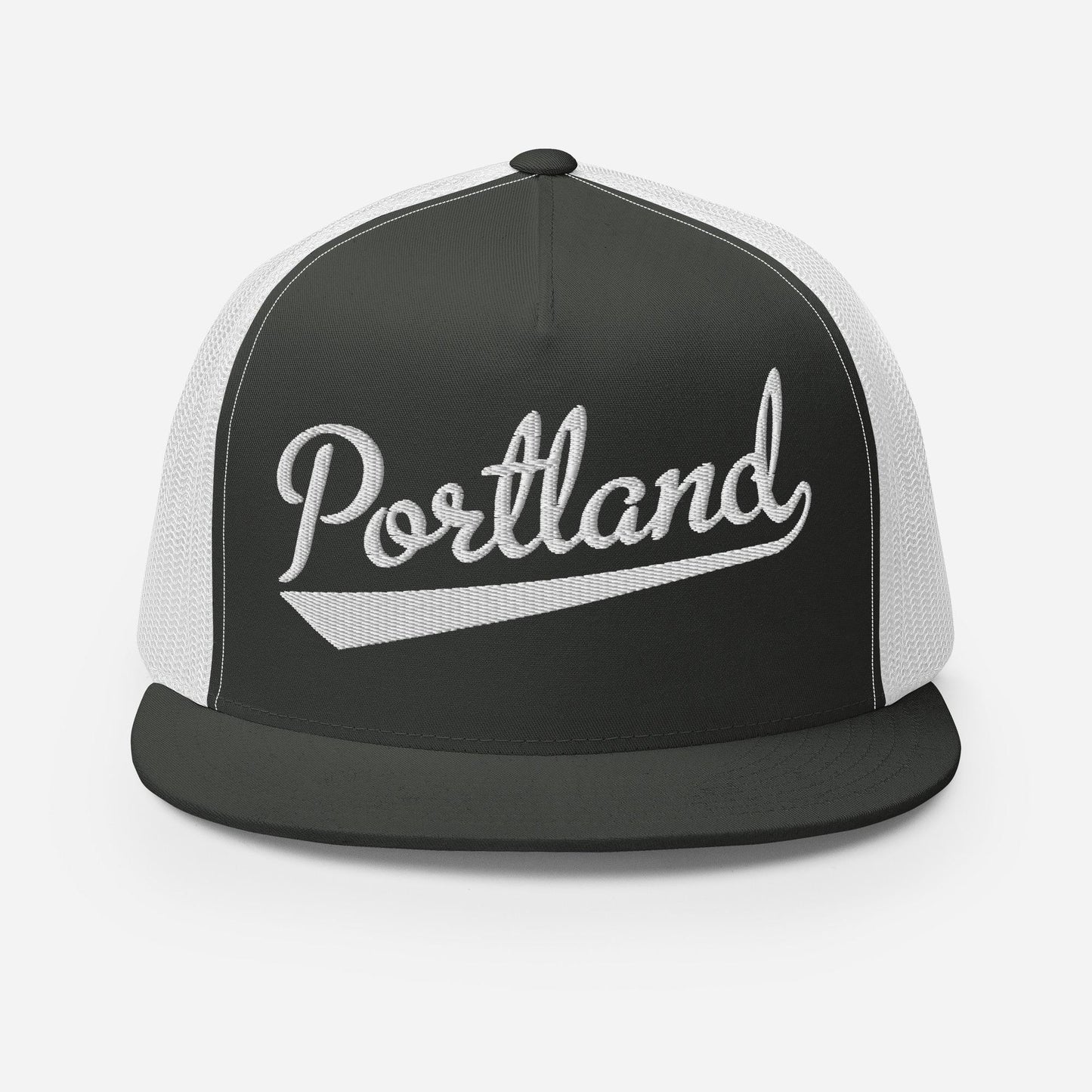 A black and white baseball cap with the word "Portland" printed on it.