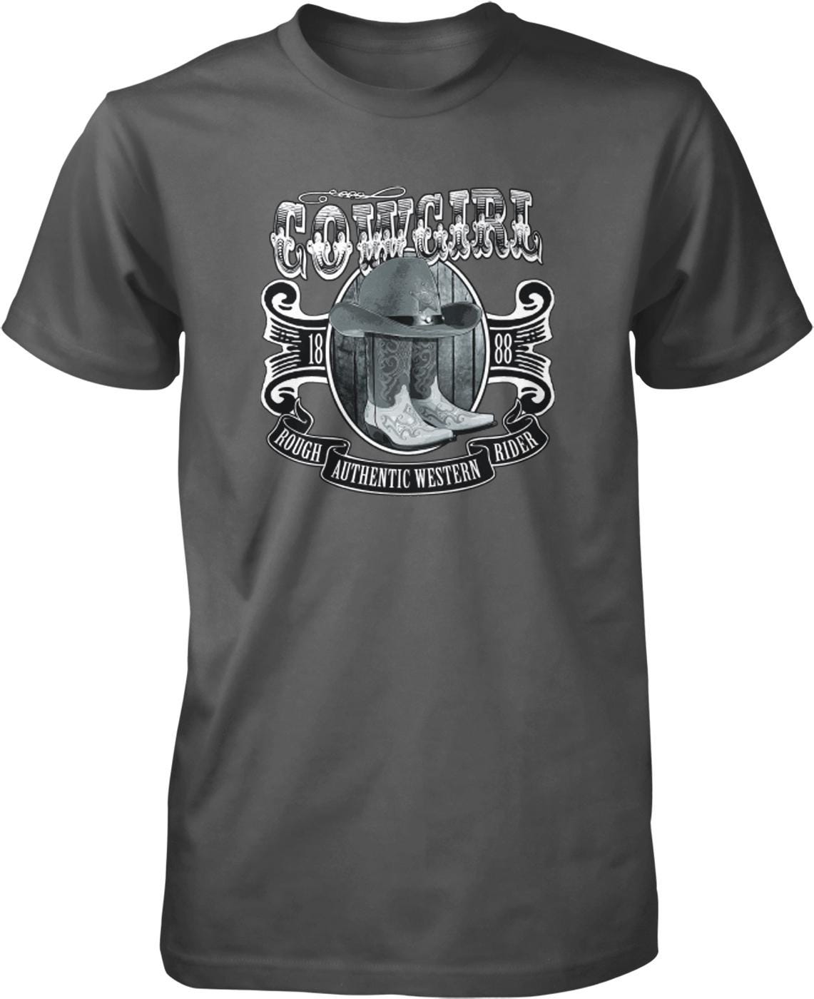 A t-shirt design featuring a cowboy hat and boots, along with the text "COWGIRL" and "ROUGH AUTHENTIC WESTERN RIDER".