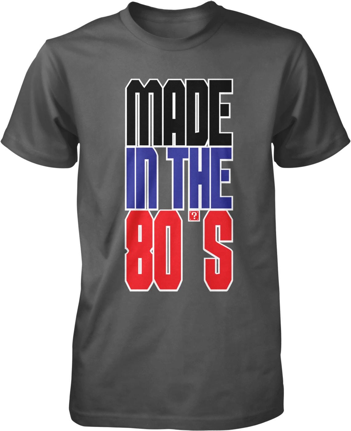 A gray t-shirt with the text "MADE IN THE 80'S" printed on it in a bold, colorful font.