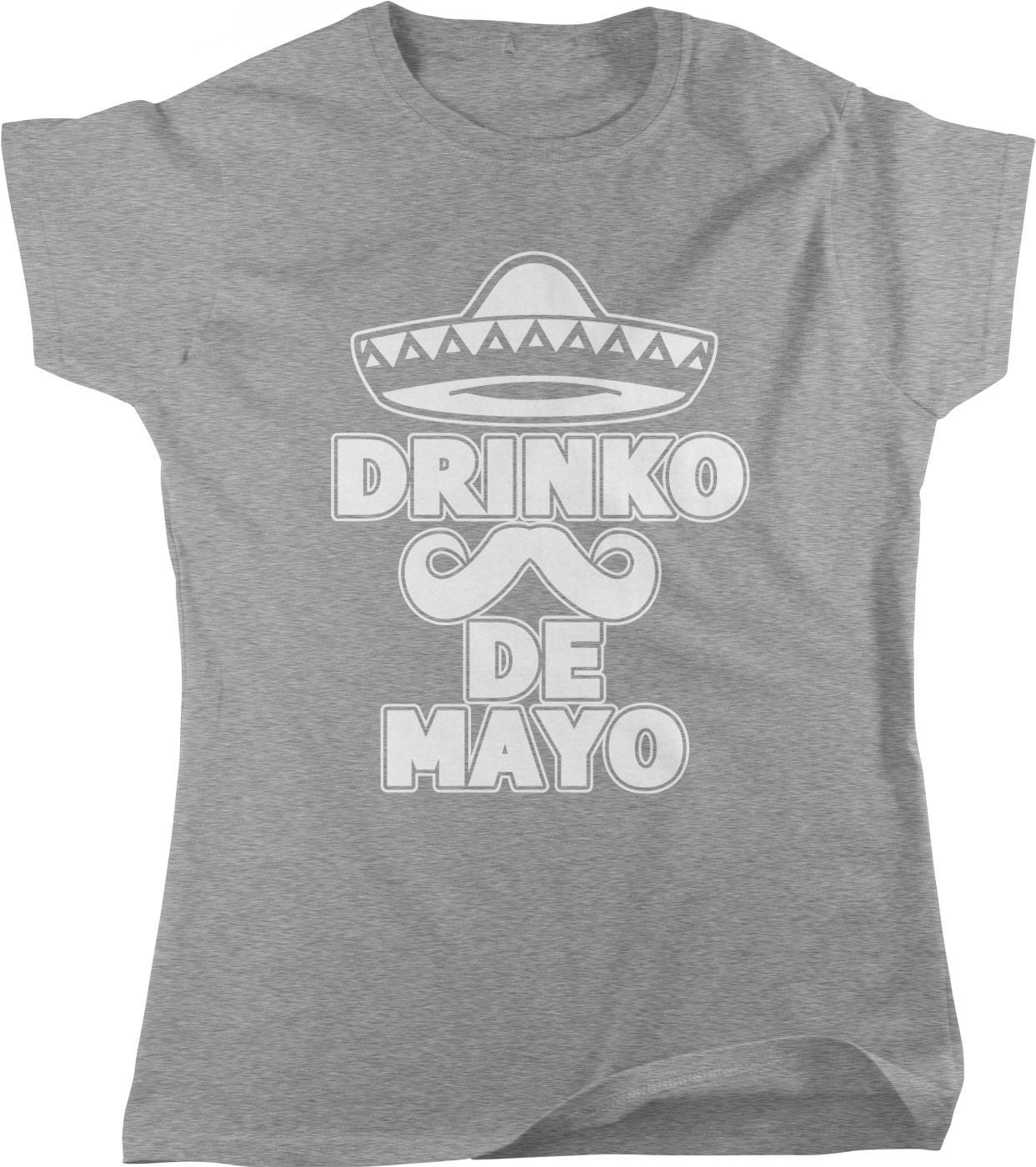 A gray t-shirt with a graphic design featuring a sombrero and mustache, along with the text "DRINKO DE MAYO" printed on it.