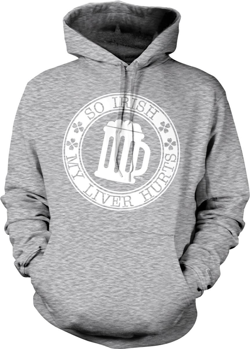 A grey hoodie with a white circular logo on the front. The logo features a mug with a beer, surrounded by the text "So Irish, my liver hurts".