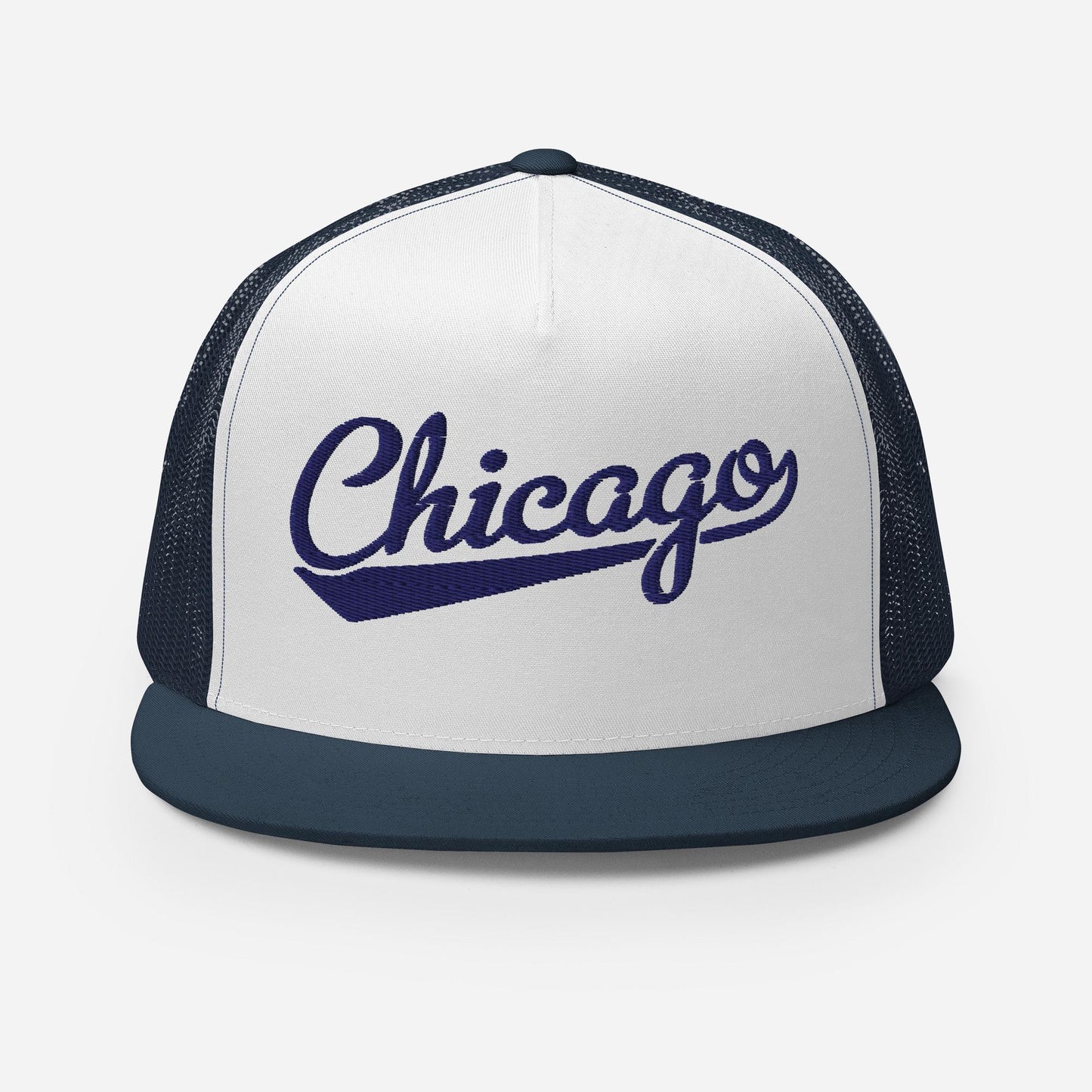 A white and navy blue baseball cap with the word "Chicago" printed on it in a cursive font.