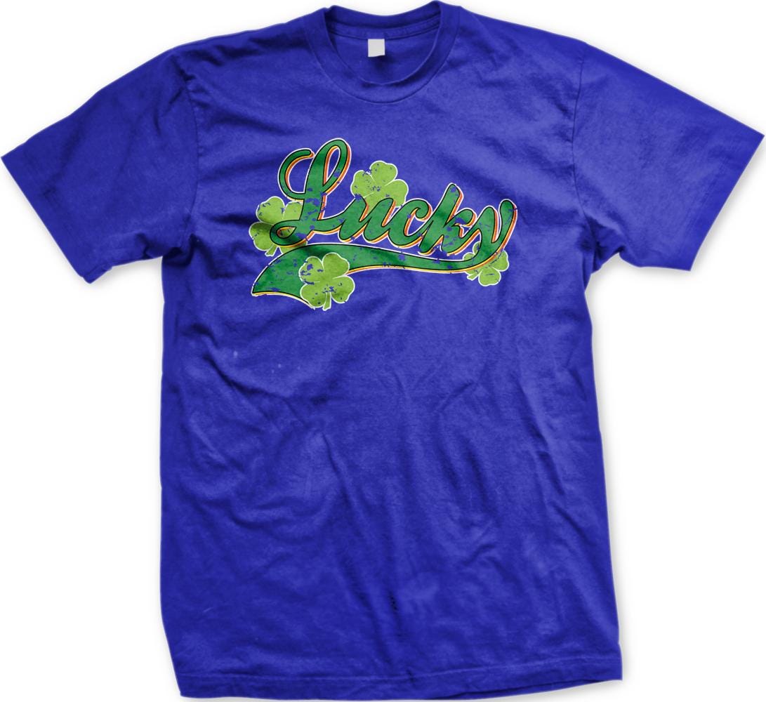 A blue t-shirt with the word "Lucky" printed on it, along with four shamrocks.