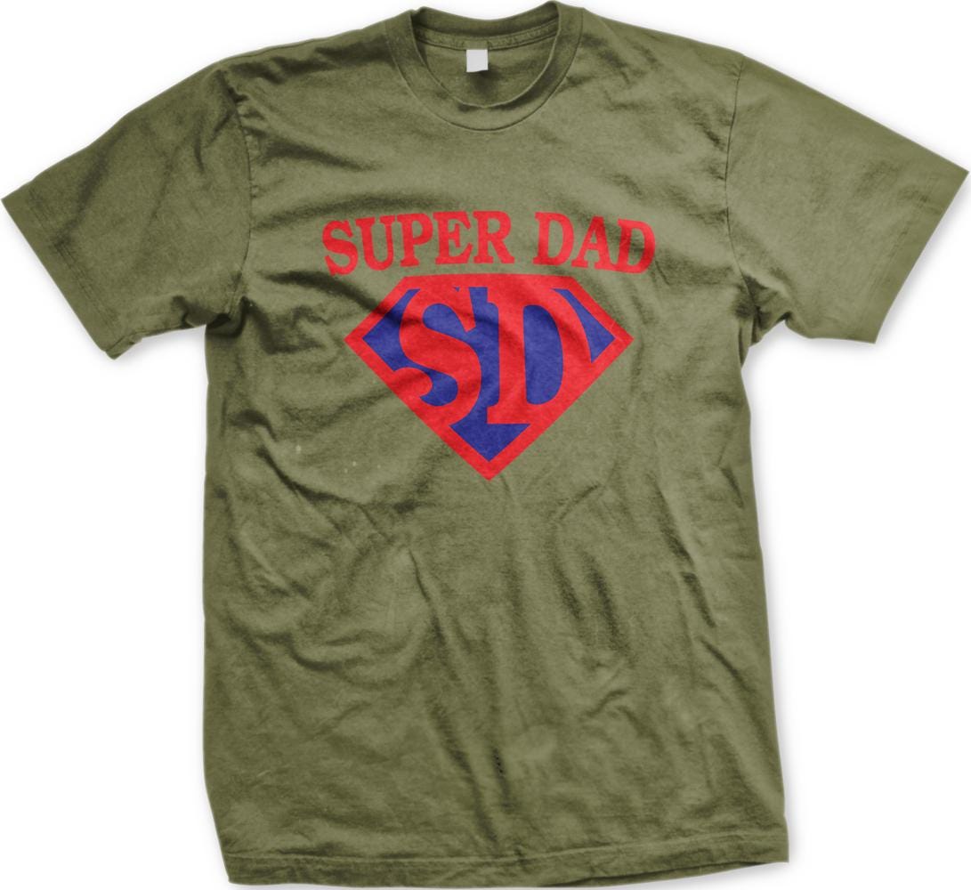 A green t-shirt with the text "SUPER DAD SID" printed on it in red and blue colors.