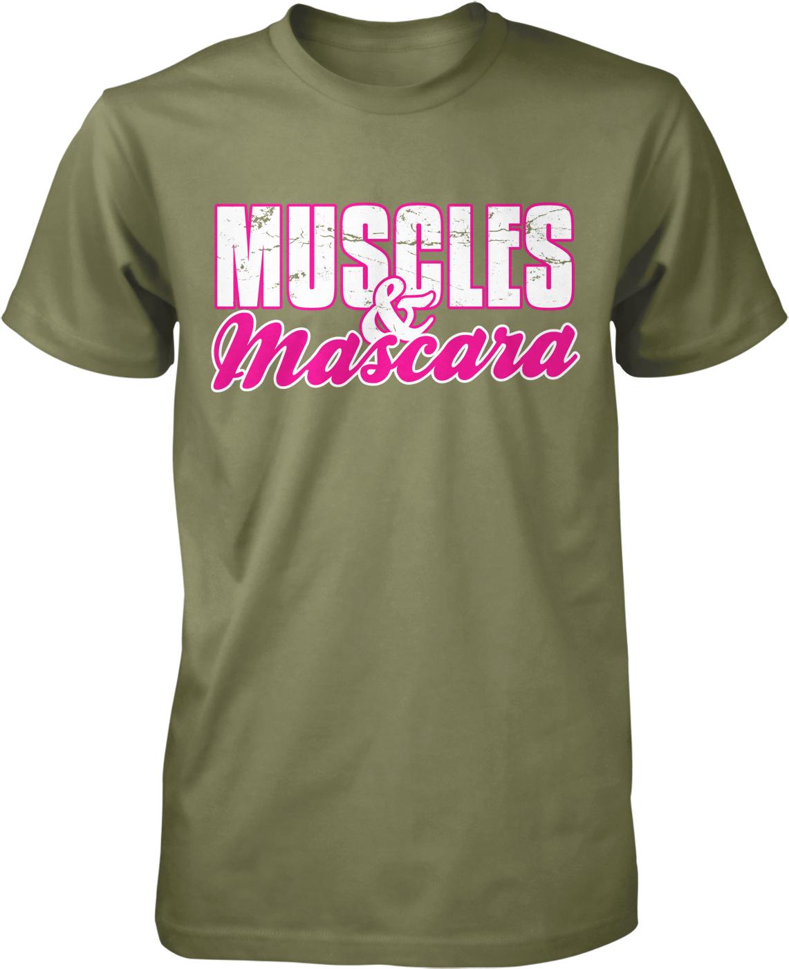 A green t-shirt with the text "MUSCLES & MASCARA" printed on it in pink and white lettering.