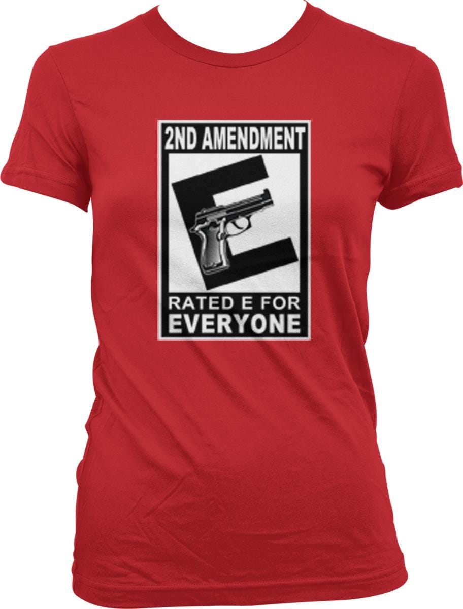 A red t-shirt with a graphic design that says "2ND AMENDMENT RATED E FOR EVERYONE" and features a graphic of a gun.