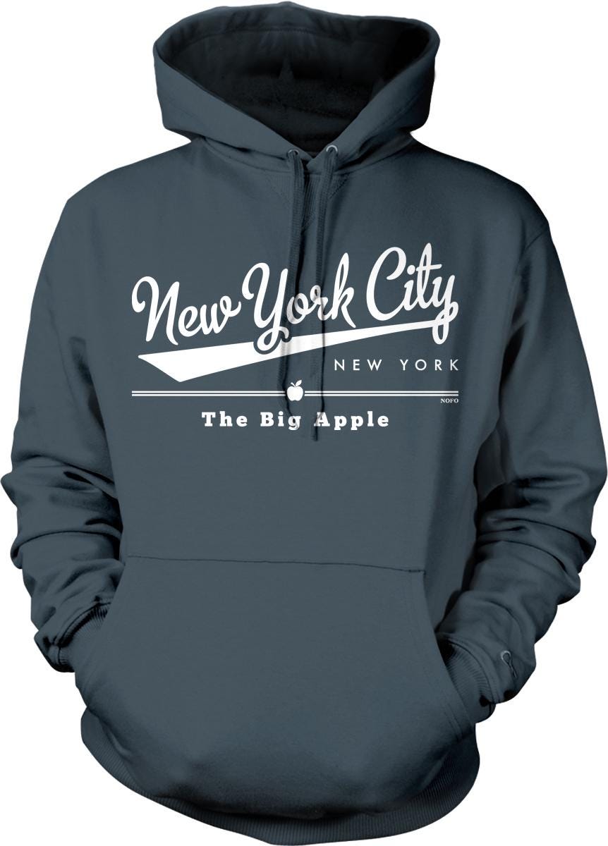 A gray hoodie with white text and graphics that say "New York City" and "The Big Apple".