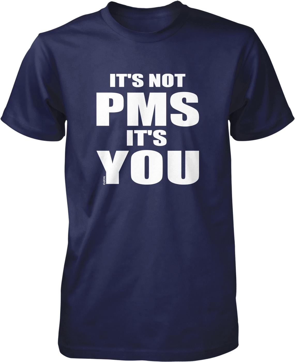 A navy blue t-shirt with white text that reads "IT'S NOT PMS IT'S YOU".
