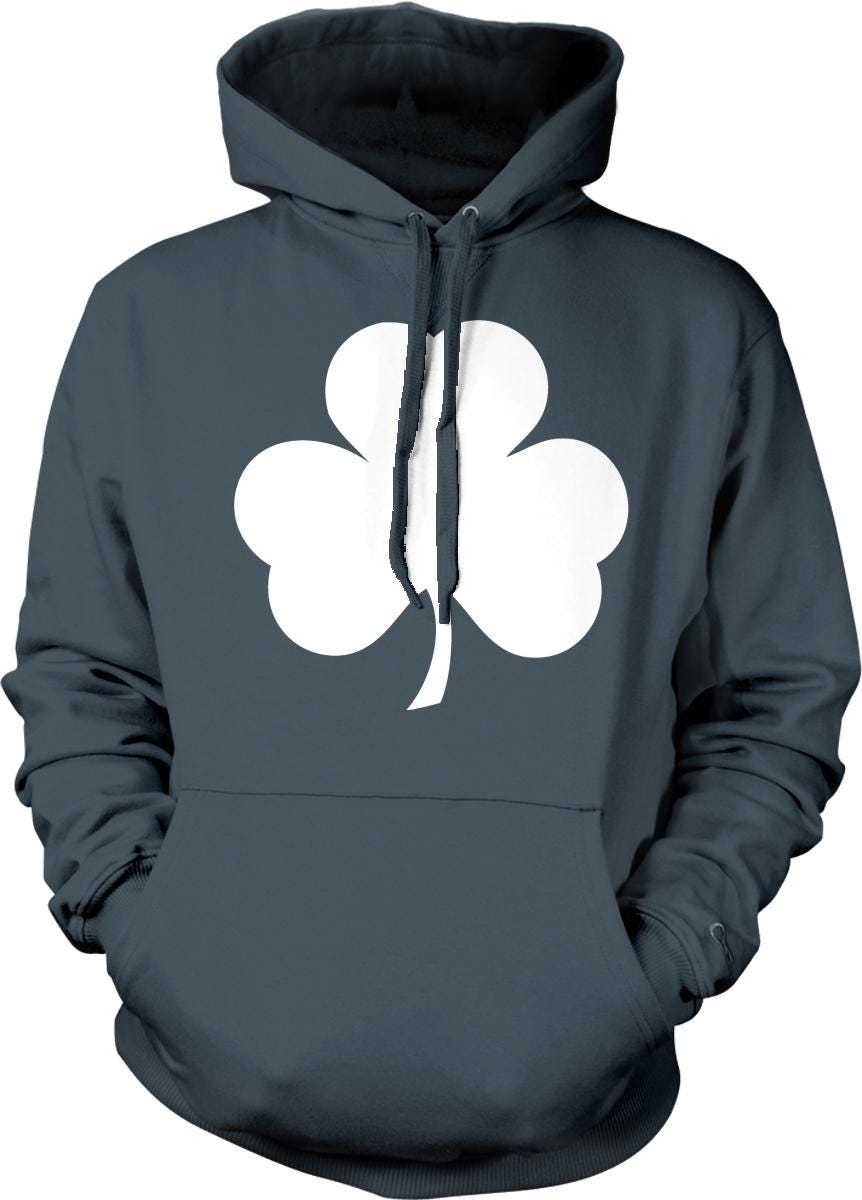 A dark grey hoodie with a white clover graphic printed on it.