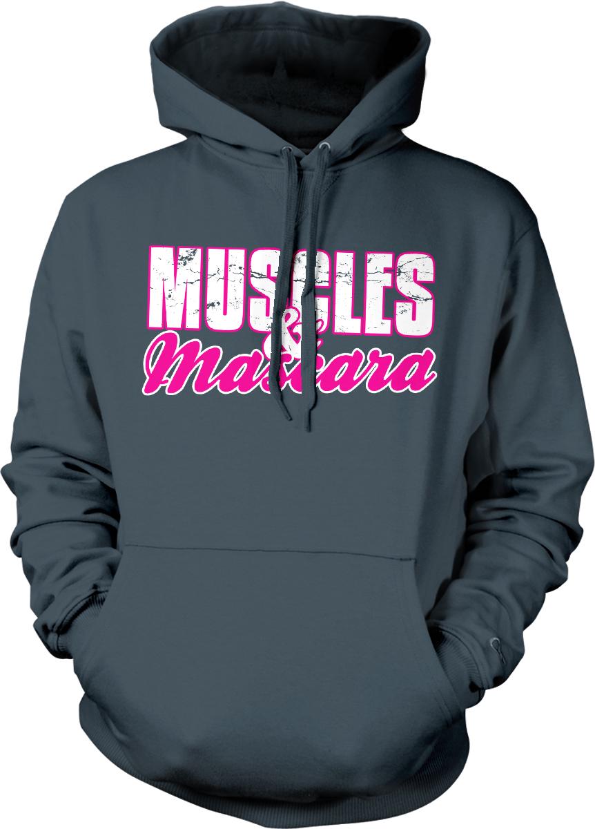A gray hoodie with the text "MUSCLES & MARS" printed on it in pink and white lettering.