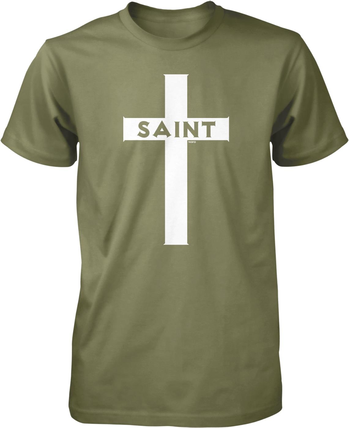 A green t-shirt with a white cross graphic and the word "SAINT" printed on it.